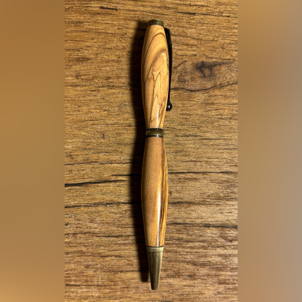 Beautiful Hand turned wood pen with black ink. Smooth writing. Antique Brass.